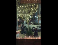 Girl on floor girl on bench christmas lights