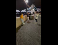 Girl black jacket tower bridge night lights