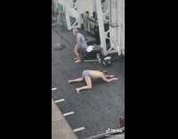 Guy in underwear stretching in gym 