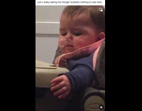 Baby blows out big snot bubble from nose