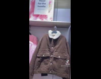 Guy in green shirt and yellow beanie head for the hoodie