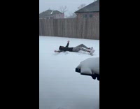 Man makes snow angel for the first time