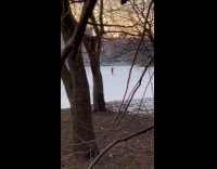 Person selfie dance video on frozen river