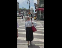 Bald woman with Mona Lisa hairstyle crosswalk