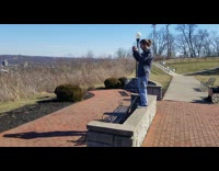 Guy Takes Photo of Ninja Turtle with City View