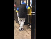 Guy squirts hand sanitizer onto black shoes