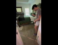 Man play fighting with dogs using sword 