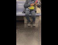 Old person cuts nails inside the train 