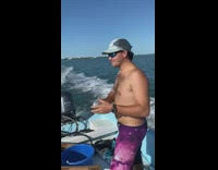 Guy on wakeboard catches seltzer can boat