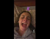 GIrl sitting in bed letter K I love you King Julian