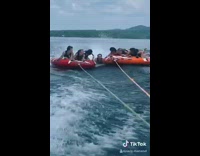 Boy falls off raft holds onto two rafts