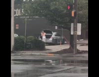 White pants girl closes trunk door friend 