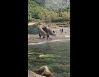 Woman bikini bend down beach tunnel graffiti