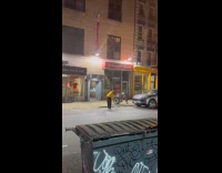 Man playing golf on the side of street 