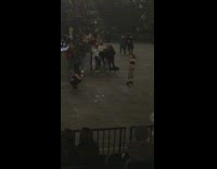 Girl black shirt floor of concert venue 