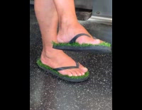 Collab Subway Creatures - Person wear slippers with bult in grass