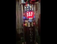 Man does spin kick on boxing arcade machine