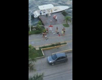 Two women in black bikini stacks near the dock