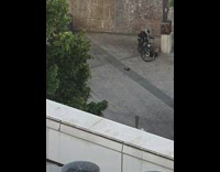 Man jacket dance sidewalk tablet on bike