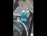 Karen dumps white trash bag blue dumpster 
