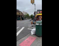 Man wearing colorful unicorn headdress and fox tail