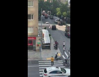 Two guys ride bicycles roof subway entrance 