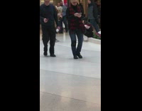 Girl takes picture fountain flowers