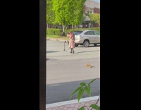 Pink plaid jacket lady parking lot tripod 