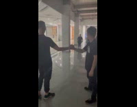 Two men dap and the sound echoes