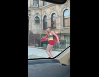 Brown robe guy dances red shorts girl 