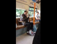 Guy on train shaves facial hair mirror 