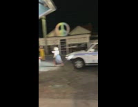 Woman black dress police car peace symbol