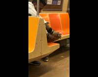 Man Cleans Foot on Subway Train Seat