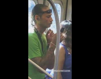 Man green shirt plucks chin beard hair with tweezers on subway train