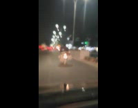 Man transporting tires and wears 2 driving beside cops