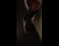 Young boy funny laugh black tile floor