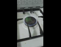 Green flame above blue fire gas stove