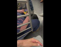 Person on train playing yellow portable game 