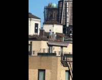 Man stretch and workout on building rooftop