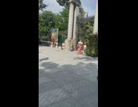 Shirtless guy skate shoes turn around gate