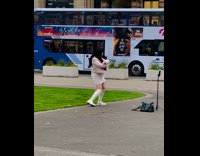 Woman in jacket tiktok dance at park