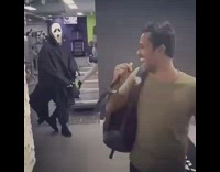 Guy walks into gym and gets scared by scream ghost costume