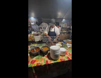 Filmer films man prepares taco in front