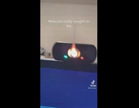Computer webcam on fire guy laughing