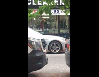 Man practices his golf swing at the cleaners shop