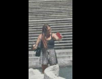 Woman black tank top selfie fix hair fountain