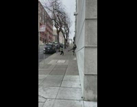 Woman black leather jacket wall sidewalk pictorial