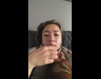 Girl wipes tears with dog ear