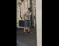 Man Pulls Weights with Head and Mask