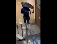 Man walk barefoot enters the subway station